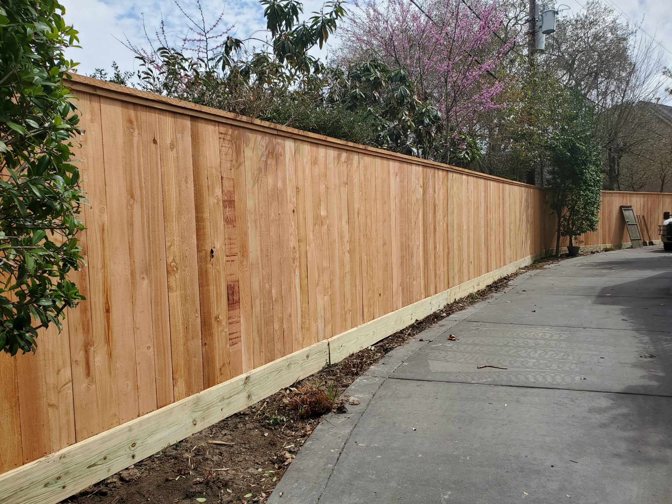 wood fence on a driveway