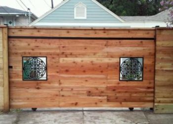 wood fence with iron window cutouts in houston