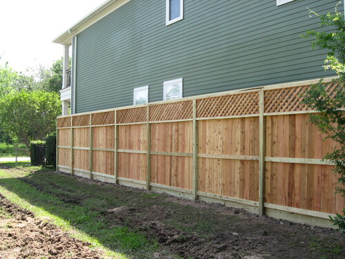 wood fence near a conroe home