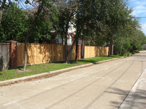 wood fence in a gated conroe community