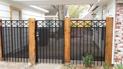 wood & wrought iron fence in the woodlands