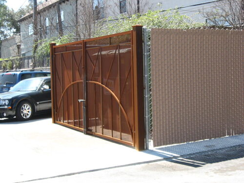 fence around an apartment trash station