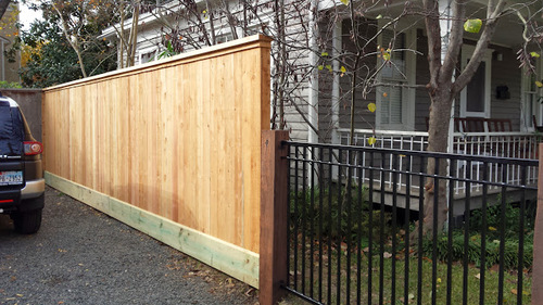 wood & wrought iron fence in katy