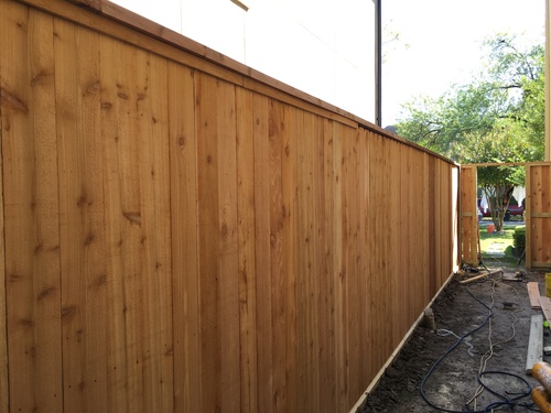 wood fence on a conroe property