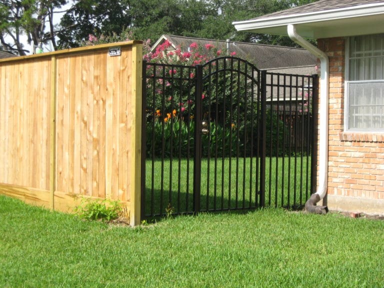 wood fence & wrought iron spring