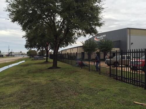 • Commercial Iron Perimeter fence at industrial property