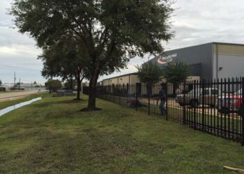 commercial iron fence outside an industrial property in houston