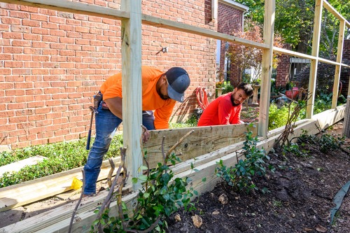 fence builders putting up a fence