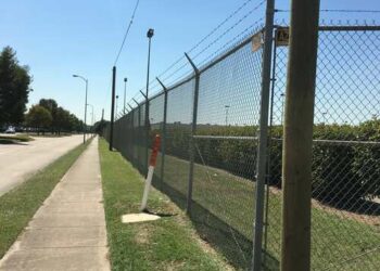 chain link perimeter with barbwire in houston