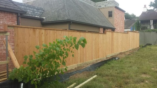 wood fence outside a home