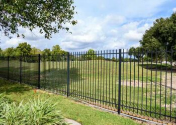 wrought iron fence outside a golf course in houston
