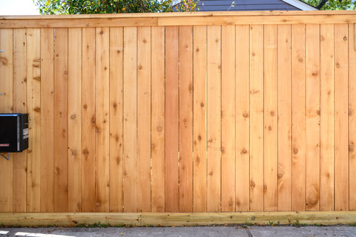 wood fence in a yard